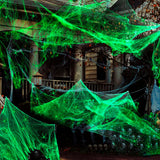 Telaraña Fluorescente con 4 Arañas de Plástico